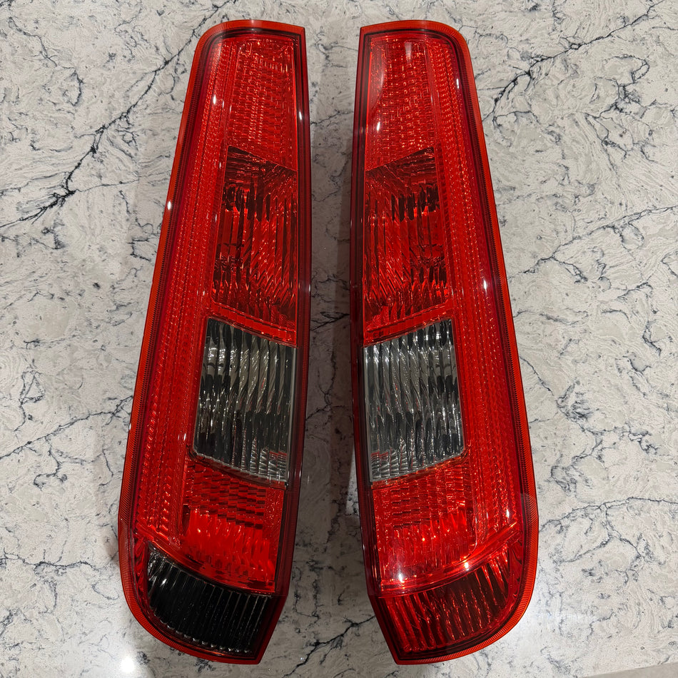 ST150 pre-facelift rear lens, never been on car still in original packaging.